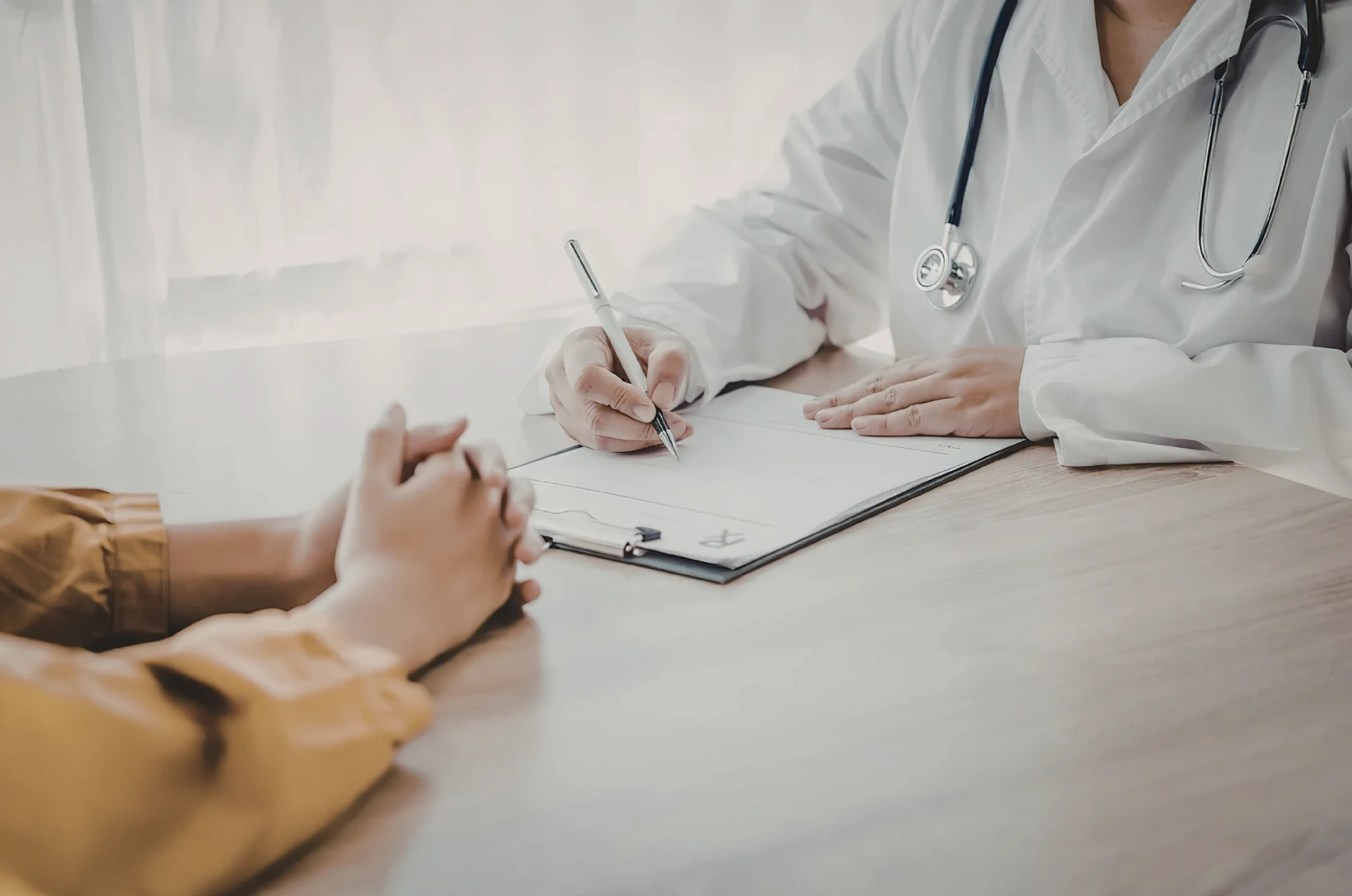 Physician reviewing a plan with a patient during a first visit